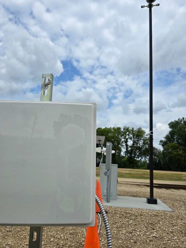 RFID antenna and camera hardware mounted at a rail yard monitoring install point